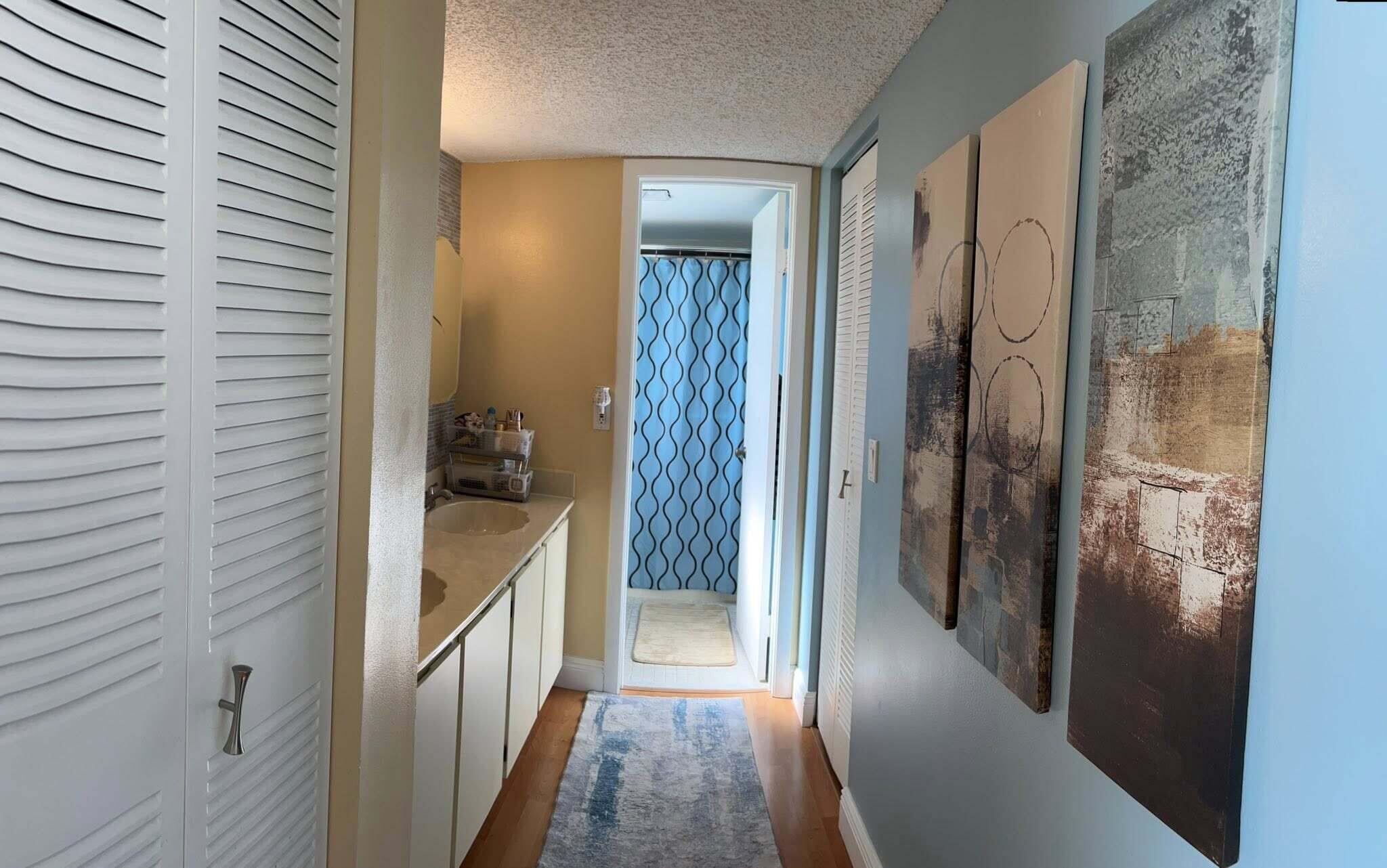 7855 Willow Spring Drive, Unit 726 Lake Worth, FL 33467 - Photo 10 of 16 a bathroom with a bathtub