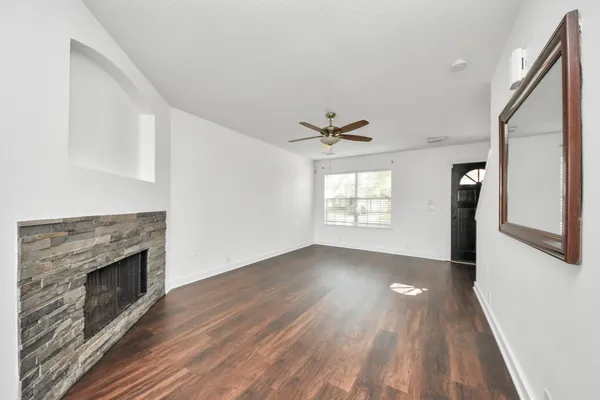 a kitchen with stainless steel appliances a stove microwave and refrigerator