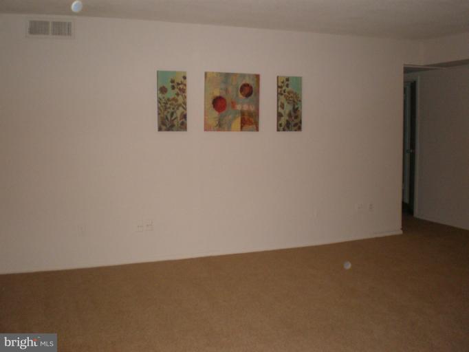 1836 Metzerott Road, Unit 1711 Hyattsville, MD 20783 - Photo 1 of 16 an ocean view with wooden floor and windows