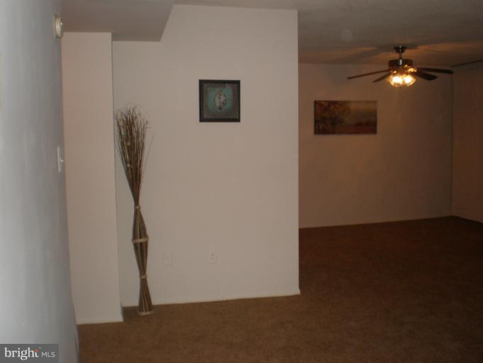 1836 Metzerott Road, Unit 1711 Hyattsville, MD 20783 - Photo 11 of 16 a view of a hallway with workspace