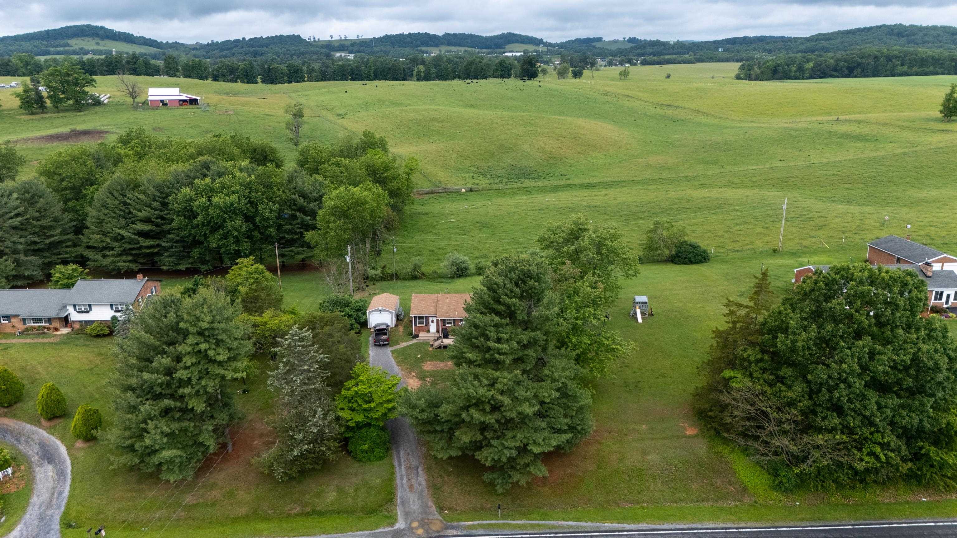 7827 Lee Highway Raphine, VA 24472 - Photo 57 of 62 a view of a lake with a houses in the background