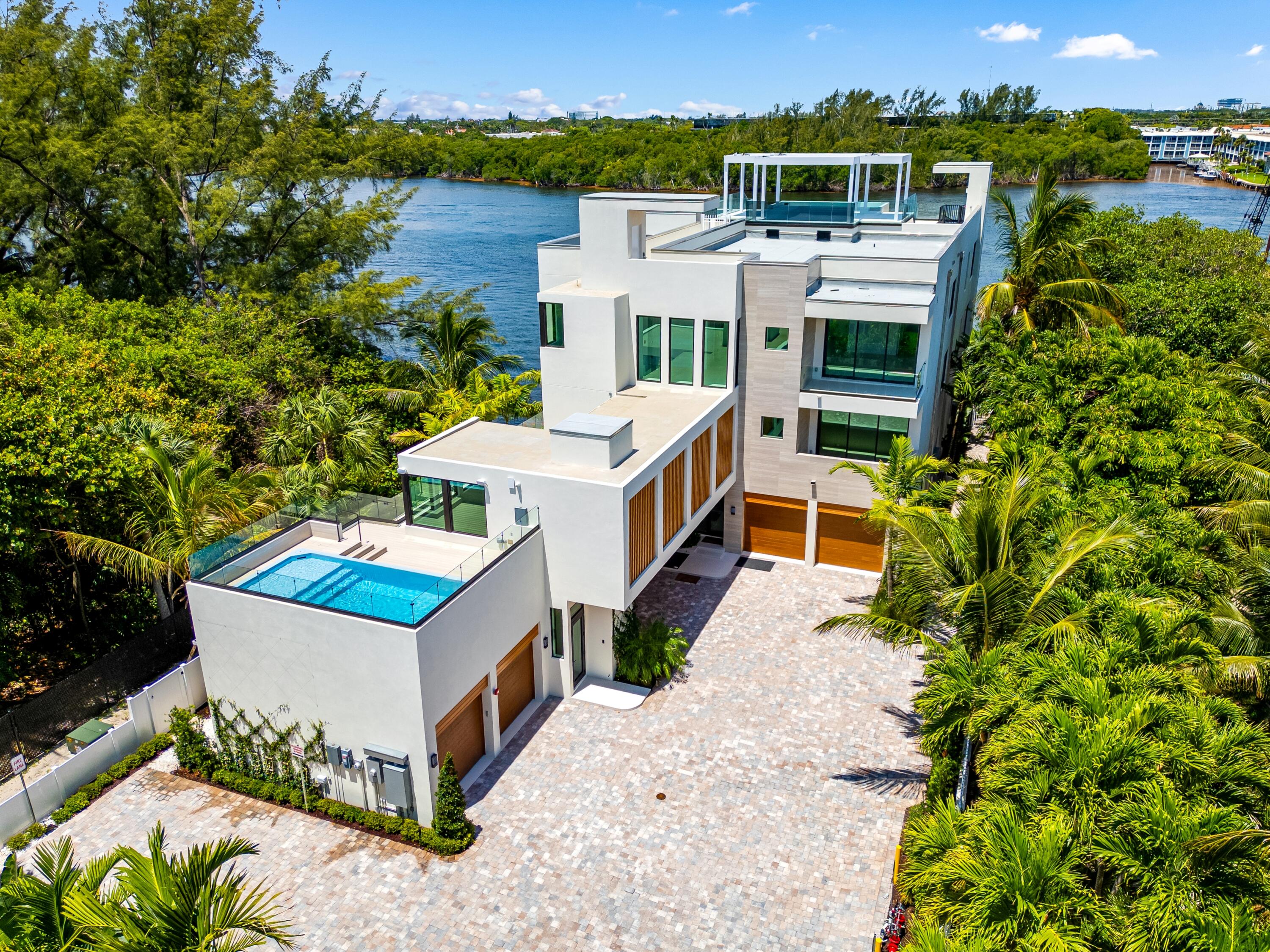 900 Lago Mar Lane, Unit PH Boca Raton, FL 33431 - Photo 1 of 58 an aerial view of a house with a garden
