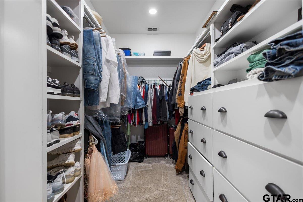 9235 Farm To Market Road 851 Rusk, TX 75785 - Photo 21 of 47 a view of walk in closet with clothes and shoes