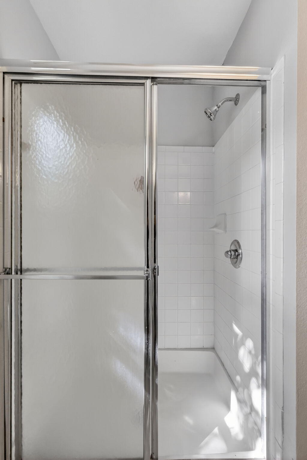 1740 Palm Cove Boulevard, Unit 4307 Delray Beach, FL 33445 - Photo 17 of 31 a bathroom with a glass shower door
