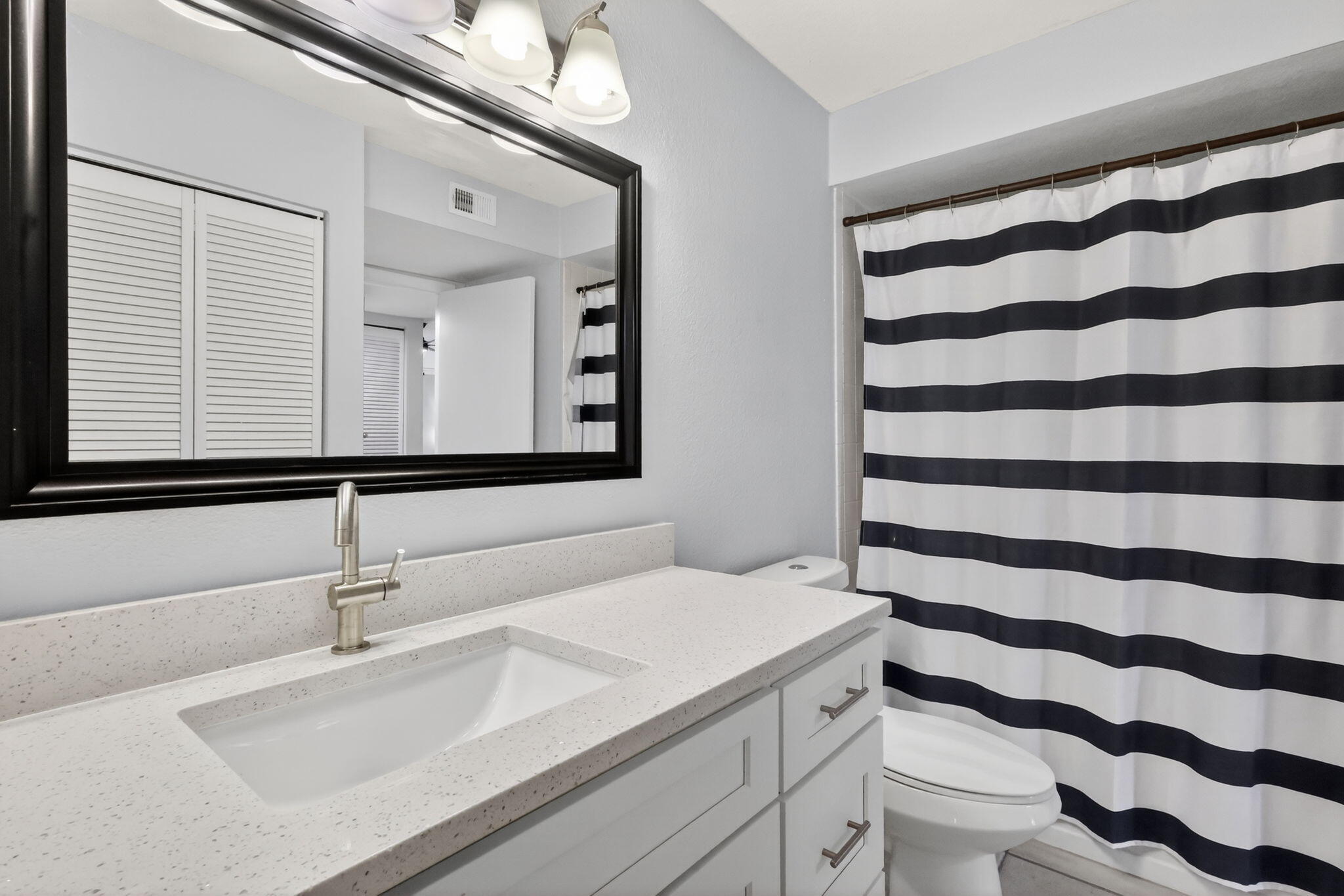 1740 Palm Cove Boulevard, Unit 4307 Delray Beach, FL 33445 - Photo 21 of 31 a bathroom with a sink and a mirror