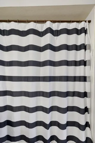 an aerial view of a house with a garden and lake view