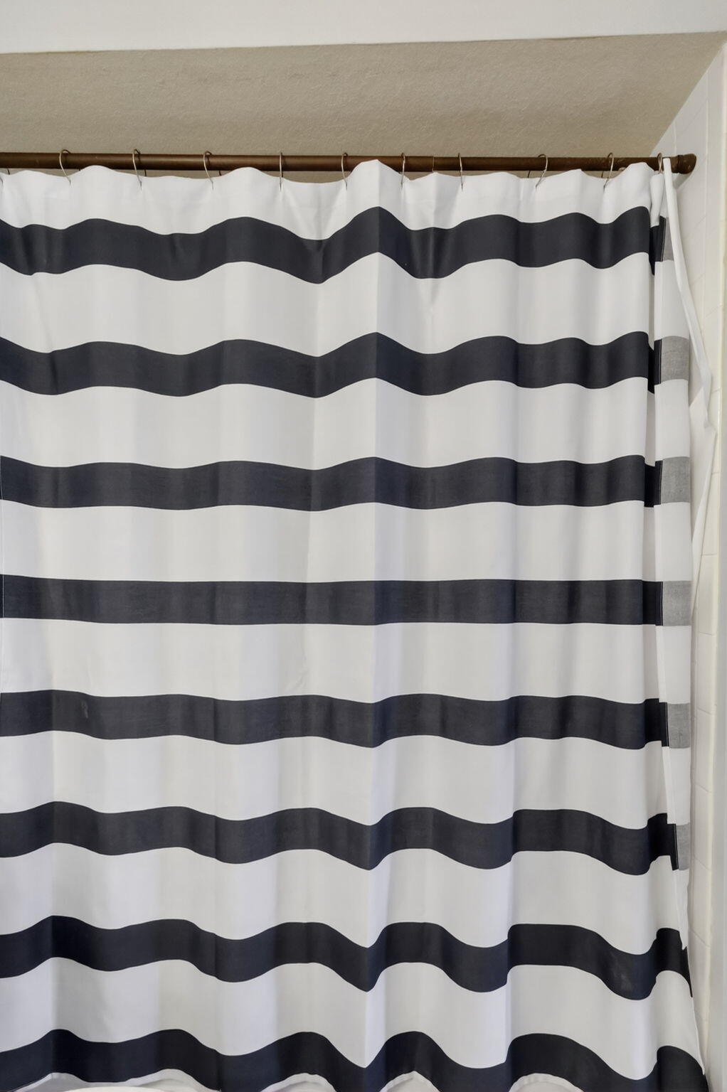 1740 Palm Cove Boulevard, Unit 4307 Delray Beach, FL 33445 - Photo 22 of 31 a view of a bathroom with a black and white checkered floor