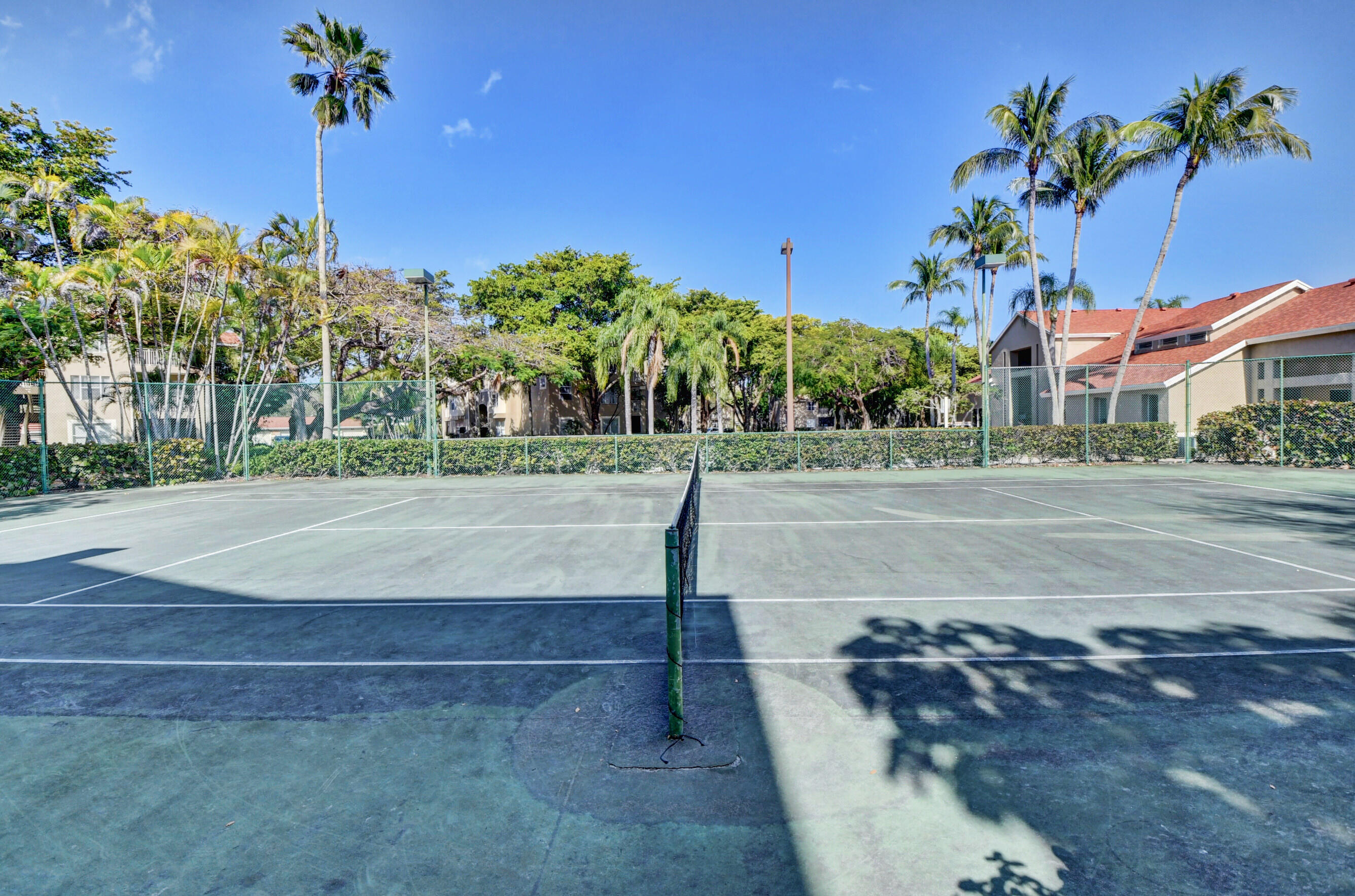 1740 Palm Cove Boulevard, Unit 4307 Delray Beach, FL 33445 - Photo 30 of 31 a view of a street with a building in the background