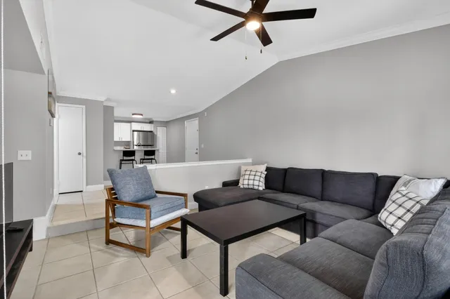 a living room with furniture and a rug