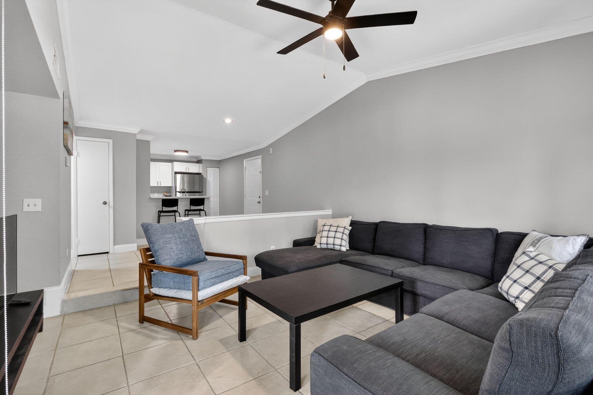 1740 Palm Cove Boulevard, Unit 4307 Delray Beach, FL 33445 - Photo 8 of 31 a living room with furniture and a rug