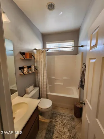 a bathroom with a sink and a shower