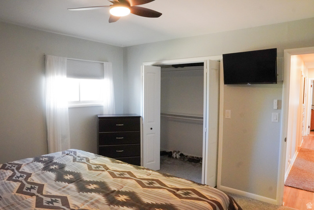 324 Stringtown Road Georgetown, ID 83239 - Photo 18 of 49 Bedroom featuring a closet, a ceiling fan, and light carpet