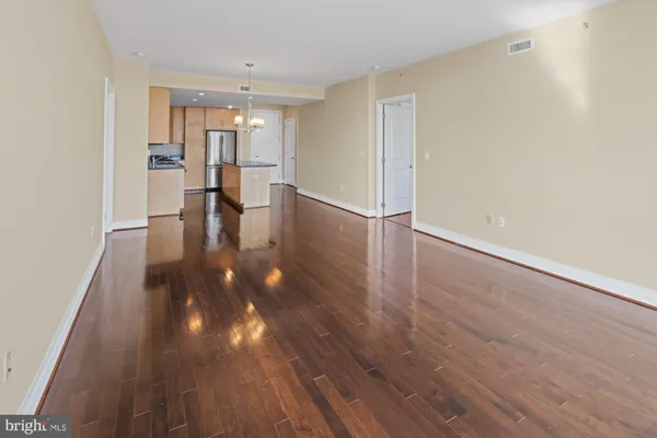 a view of an empty room and closet area