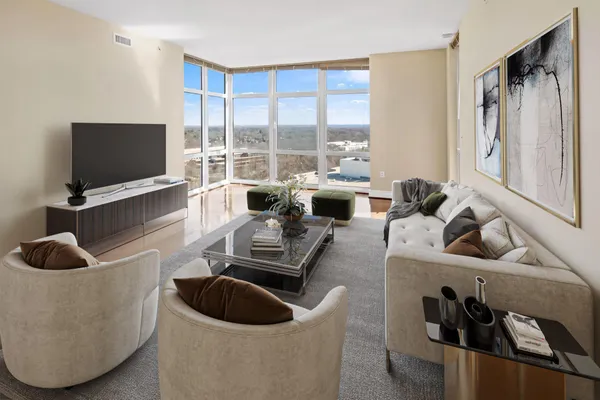a living room with furniture and a flat screen tv
