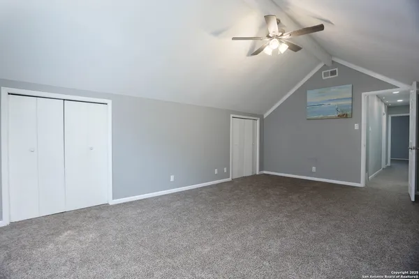 an empty room with a empty space and windows