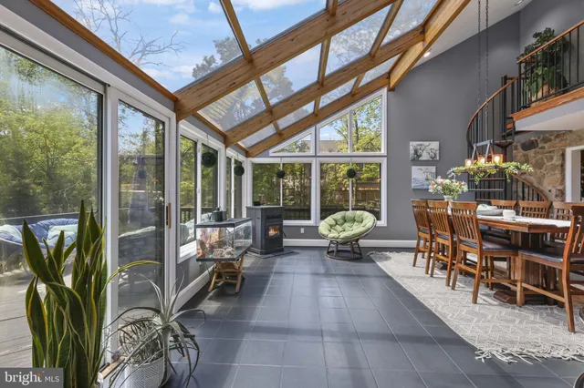 a view of a dining room with furniture and a window