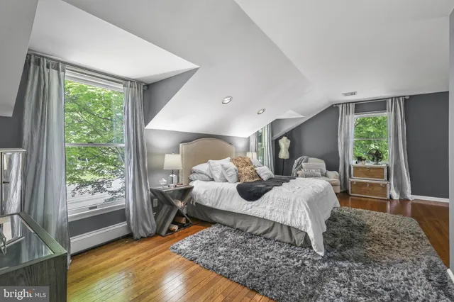 a bed room with a bed and window