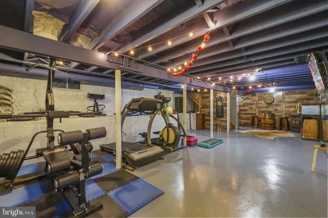 a view of a patio with dining table and chairs with wooden floor and fence