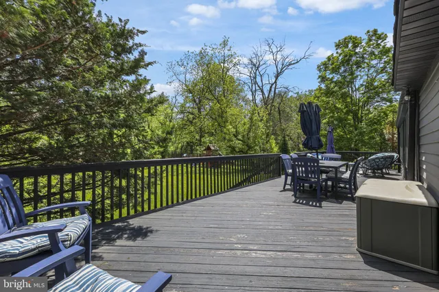 a view of a patio with couches chairs and potted plants