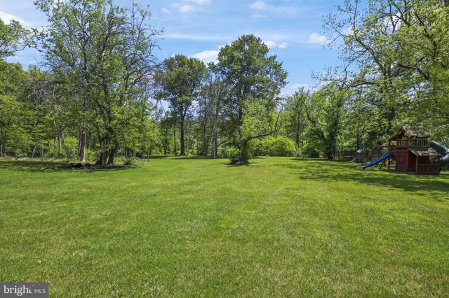 a view of a chair and tables in the patio