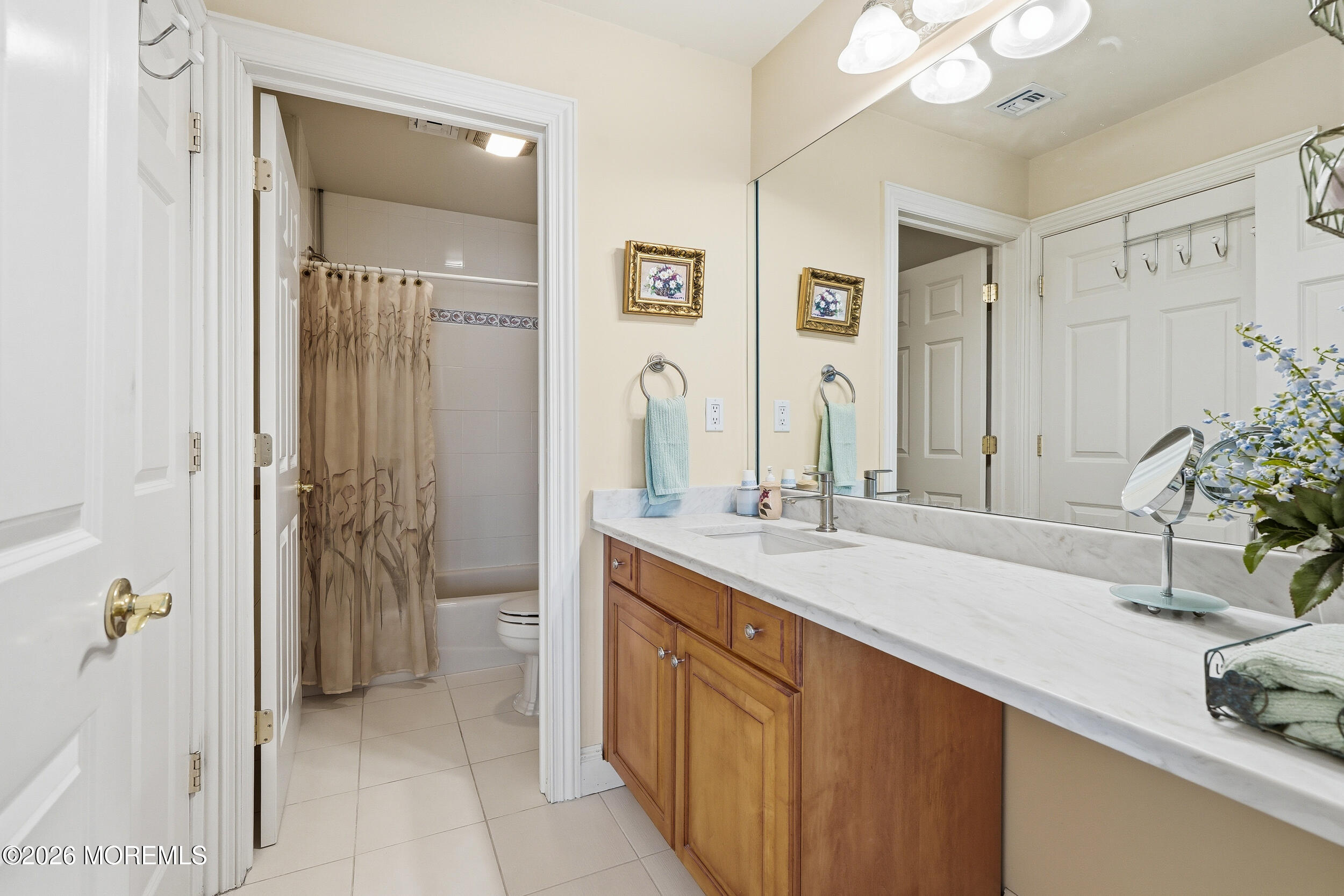 478 Rickey Lane Long Branch, NJ 07740 - Photo 45 of 64 a spacious bathroom with a sink and a mirror