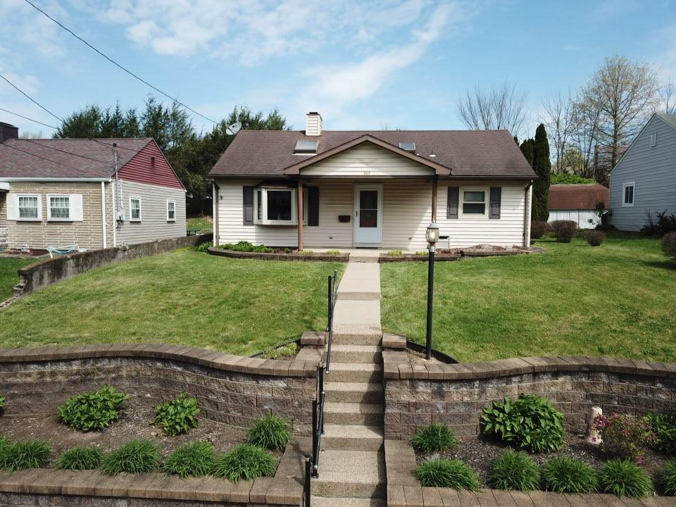 203 Carson Street Springdale, PA 15144 - Photo 33 of 43 a front view of a house with a yard