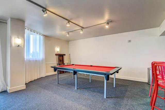 a room with musical instruments and air hockey table