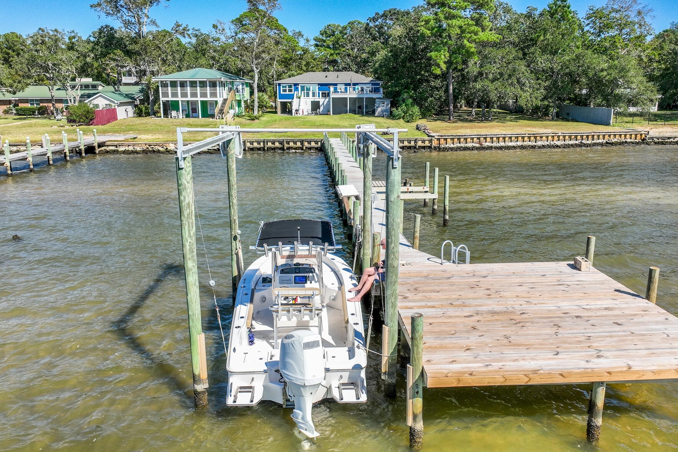 2766 Bay Grove Road Freeport, FL 32439 - Photo 14 of 55 a view of swimming pool with outdoor seating and lake view