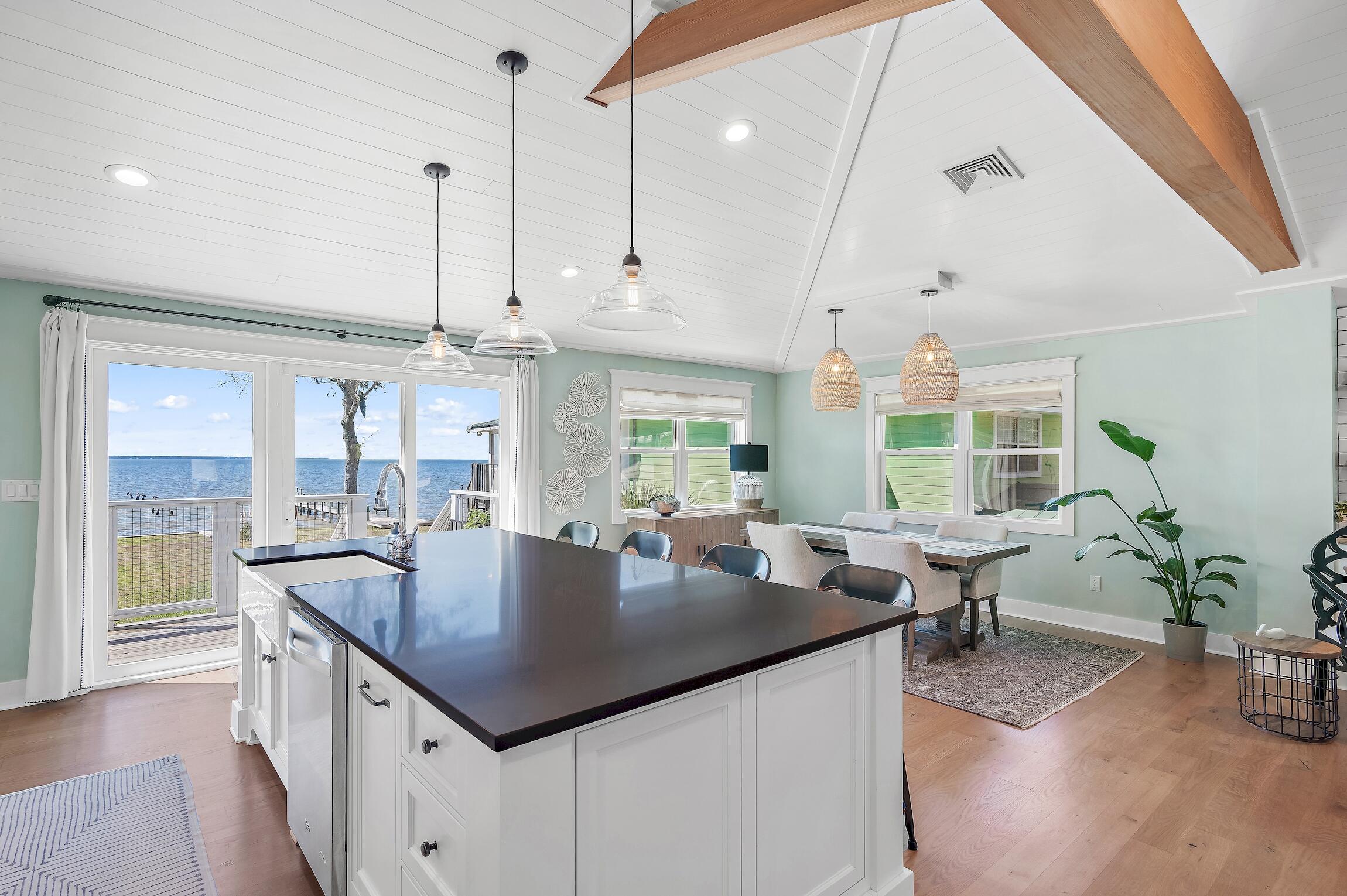 2766 Bay Grove Road Freeport, FL 32439 - Photo 22 of 55 a kitchen with center island table and chairs in it