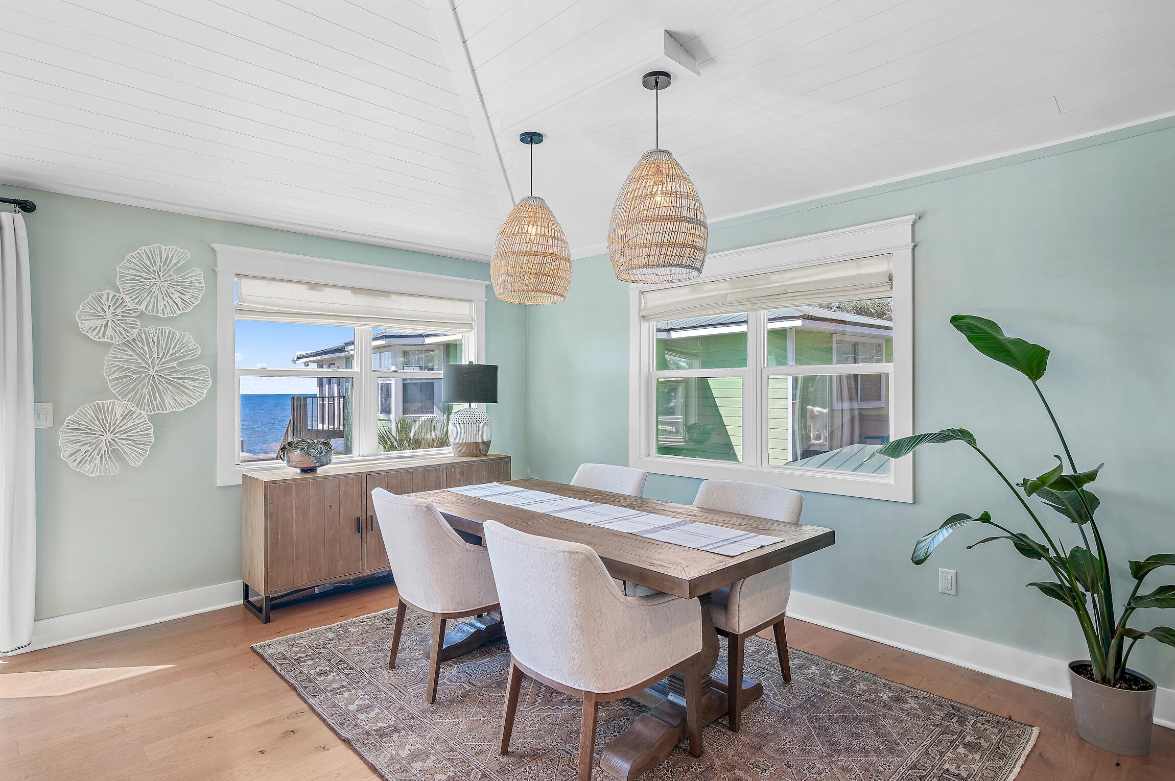 2766 Bay Grove Road Freeport, FL 32439 - Photo 24 of 55 a view of a dining room with furniture window and wooden floor