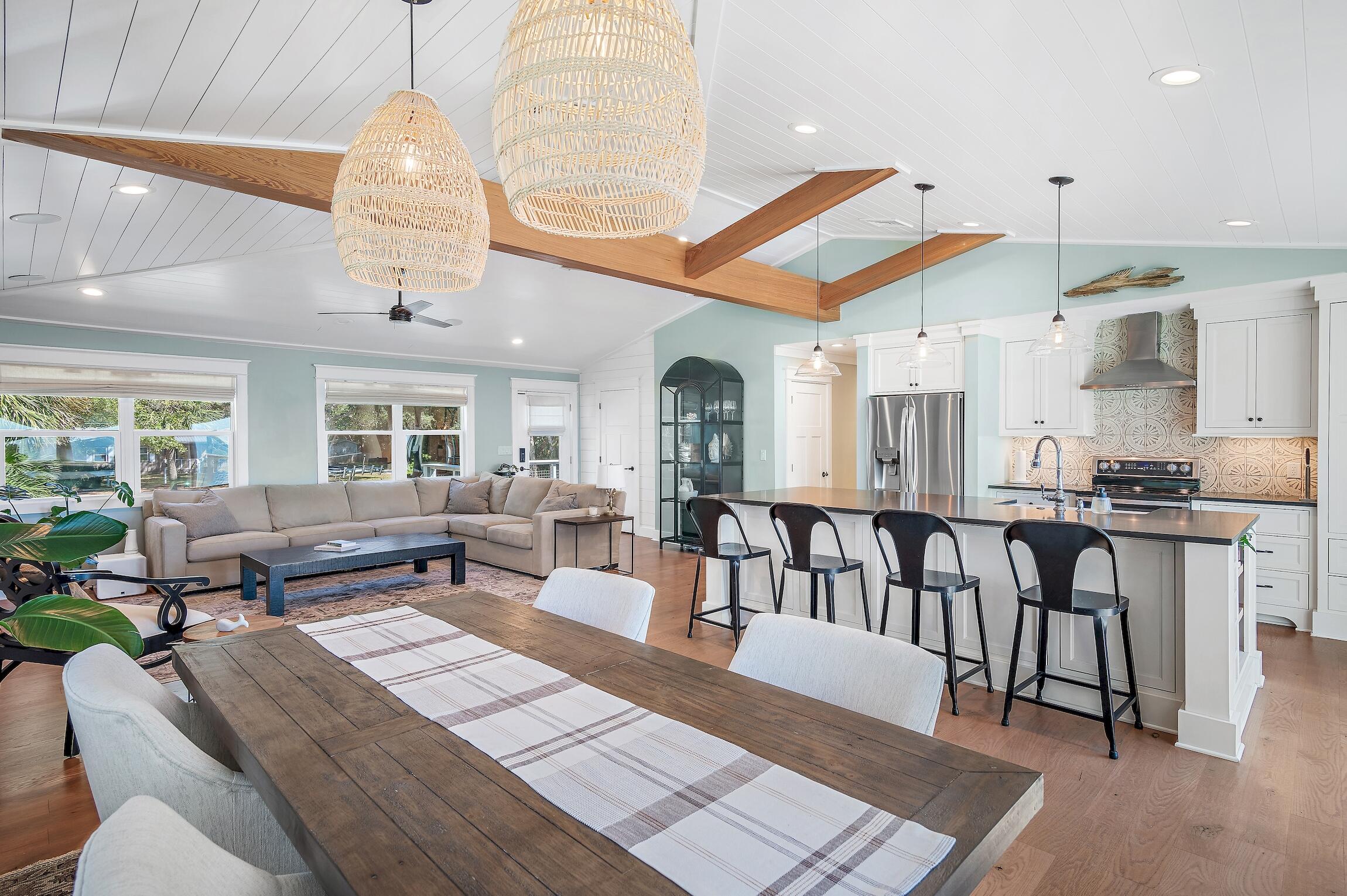 2766 Bay Grove Road Freeport, FL 32439 - Photo 25 of 55 a living room with lots of furniture and a dining table with kitchen view