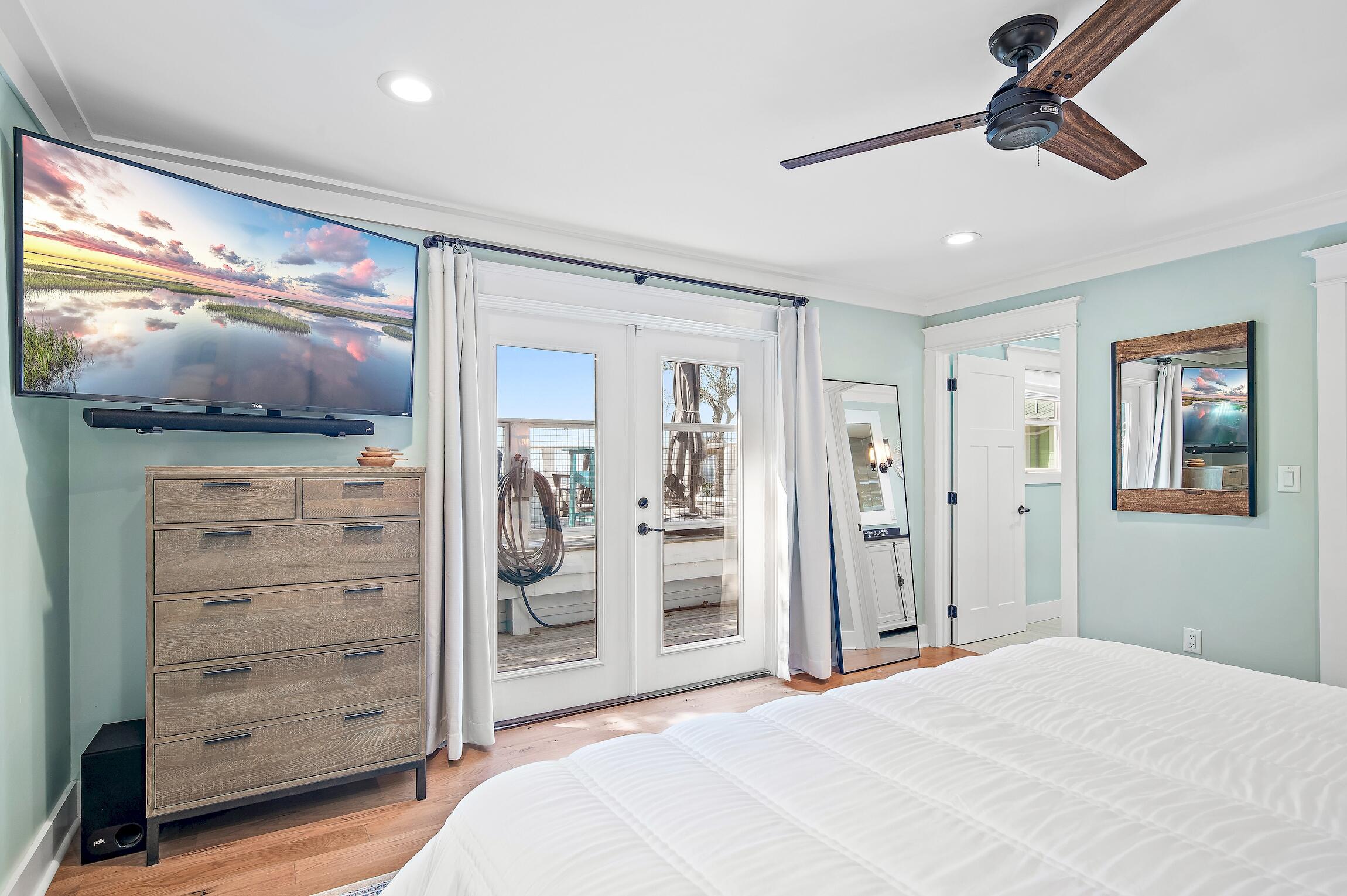 2766 Bay Grove Road Freeport, FL 32439 - Photo 31 of 55 a bedroom with a bed and a flat tv screen