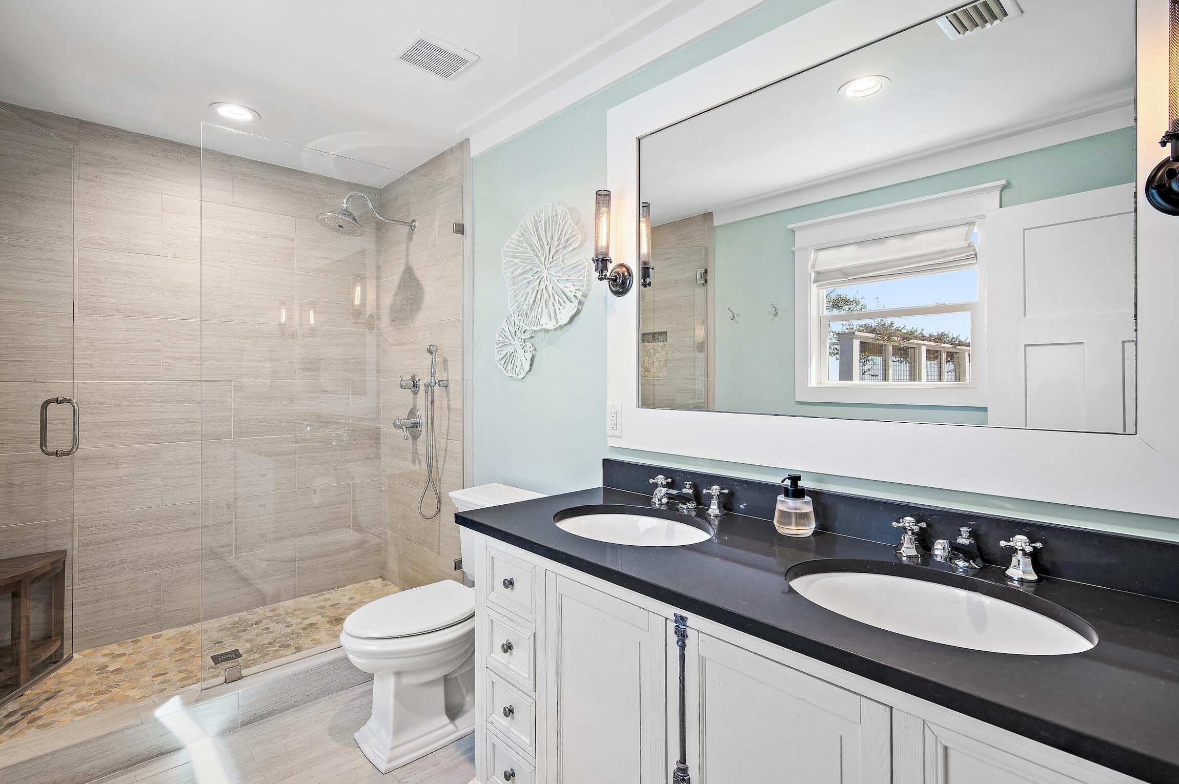 2766 Bay Grove Road Freeport, FL 32439 - Photo 33 of 55 a bathroom with a sink a toilet a shower and a mirror