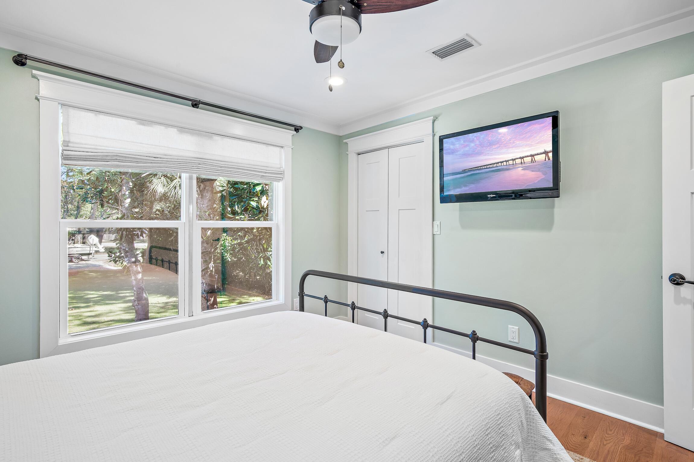 2766 Bay Grove Road Freeport, FL 32439 - Photo 36 of 55 a bedroom with a bed and a large window