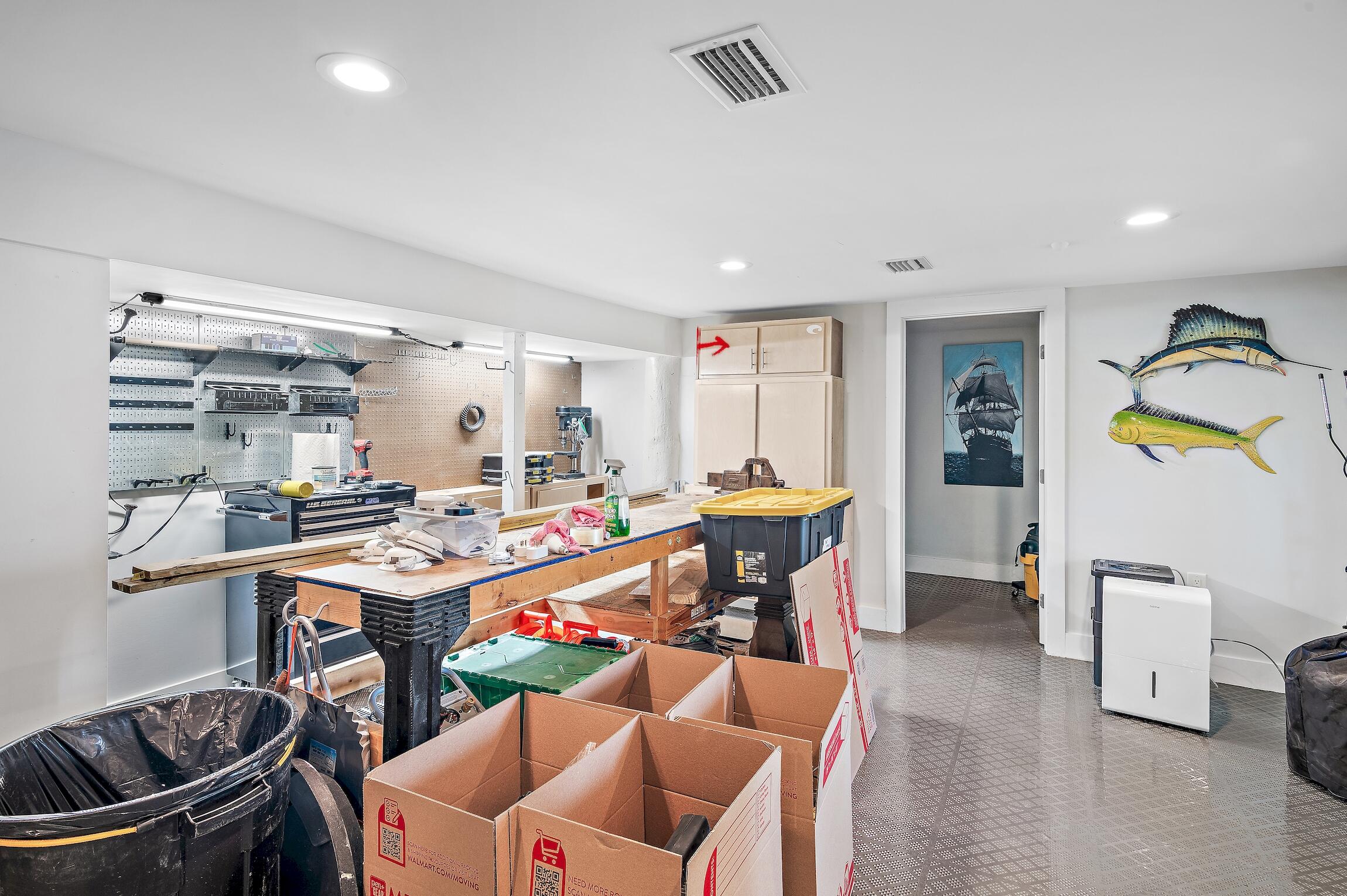 2766 Bay Grove Road Freeport, FL 32439 - Photo 39 of 55 a living room with furniture a desk and chair with the view of kitchen
