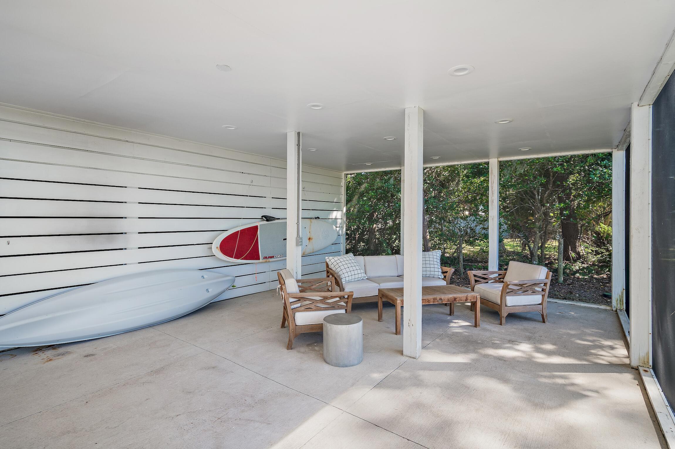2766 Bay Grove Road Freeport, FL 32439 - Photo 44 of 55 a living room with furniture and a floor to ceiling window