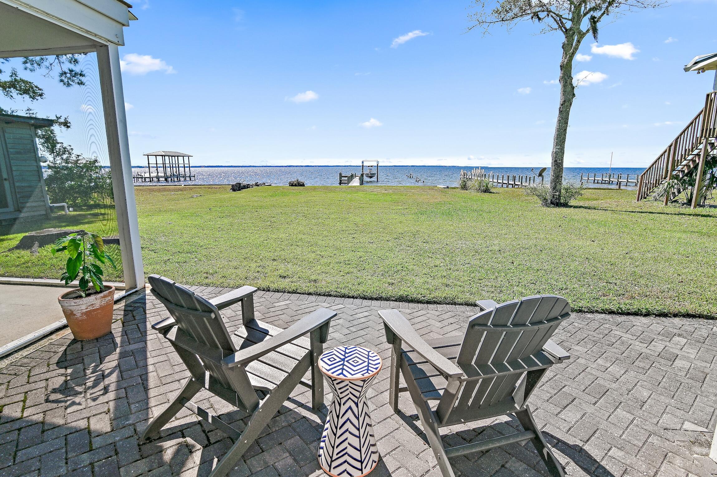 2766 Bay Grove Road Freeport, FL 32439 - Photo 46 of 55 a view of an chairs and table in the patio