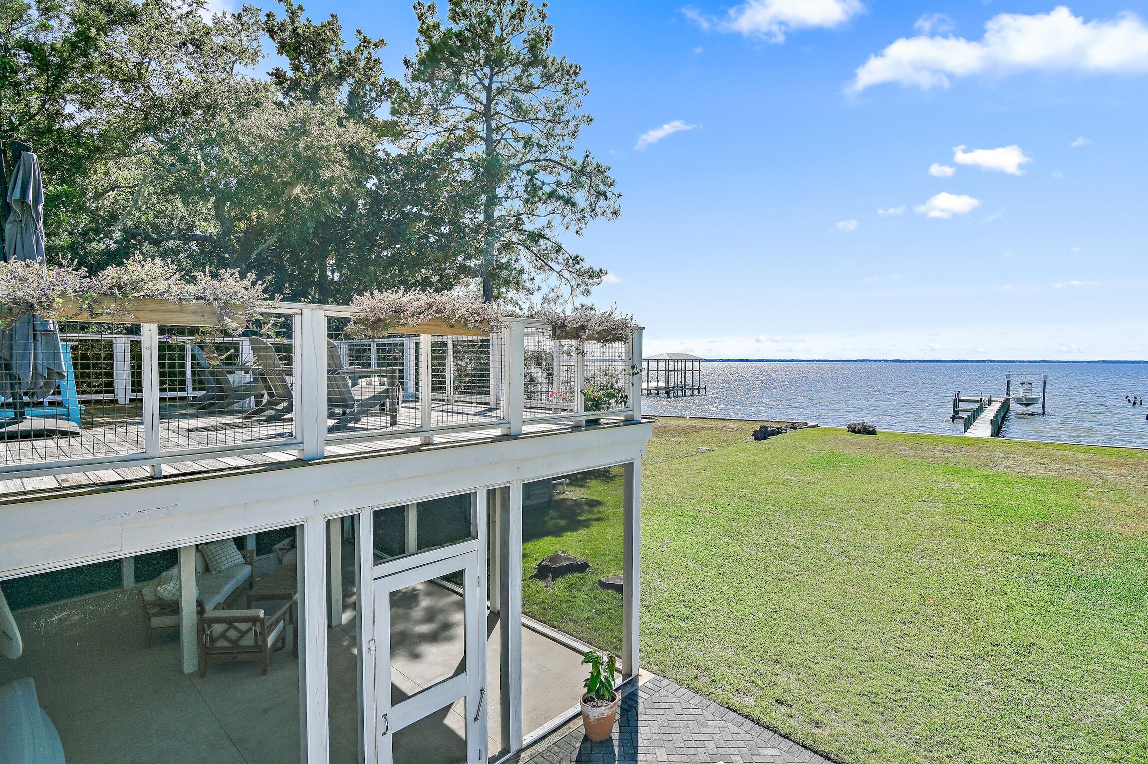 2766 Bay Grove Road Freeport, FL 32439 - Photo 47 of 55 a balcony with table and chairs