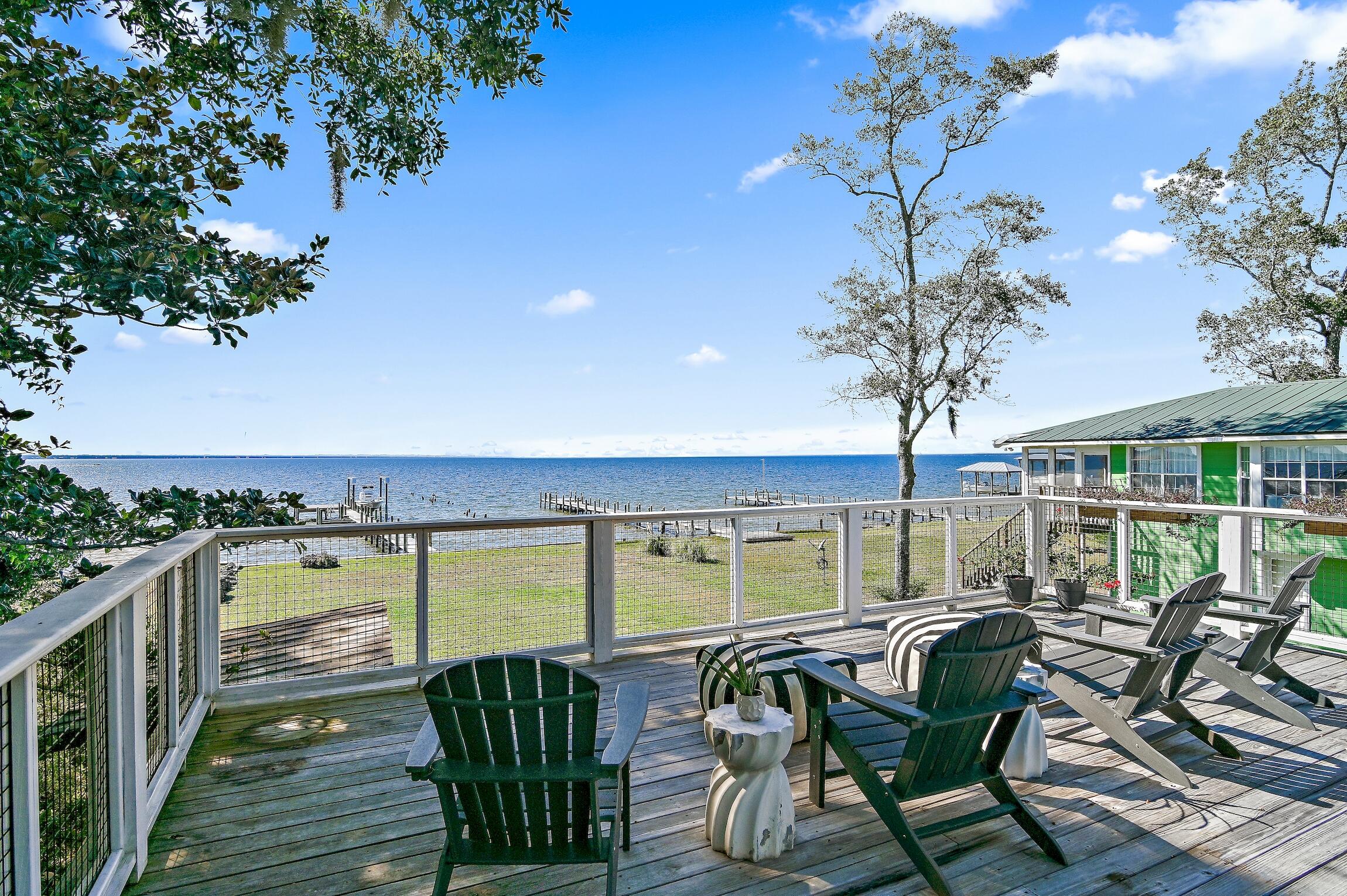 2766 Bay Grove Road Freeport, FL 32439 - Photo 49 of 55 a view of a chairs and table on the deck in the balcony