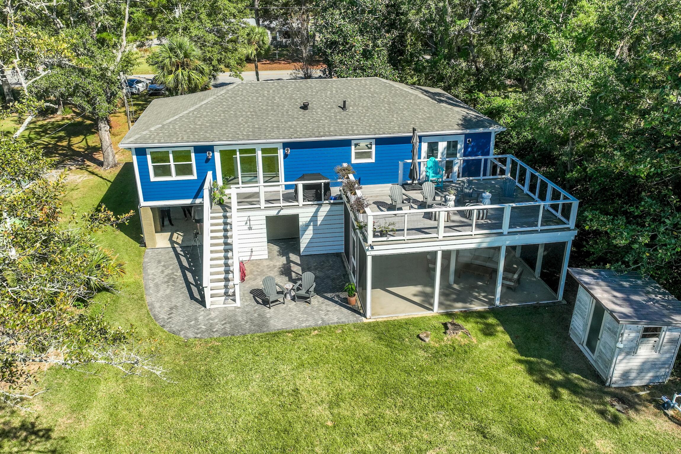 2766 Bay Grove Road Freeport, FL 32439 - Photo 6 of 55 a front view of a house with a yard table and chairs