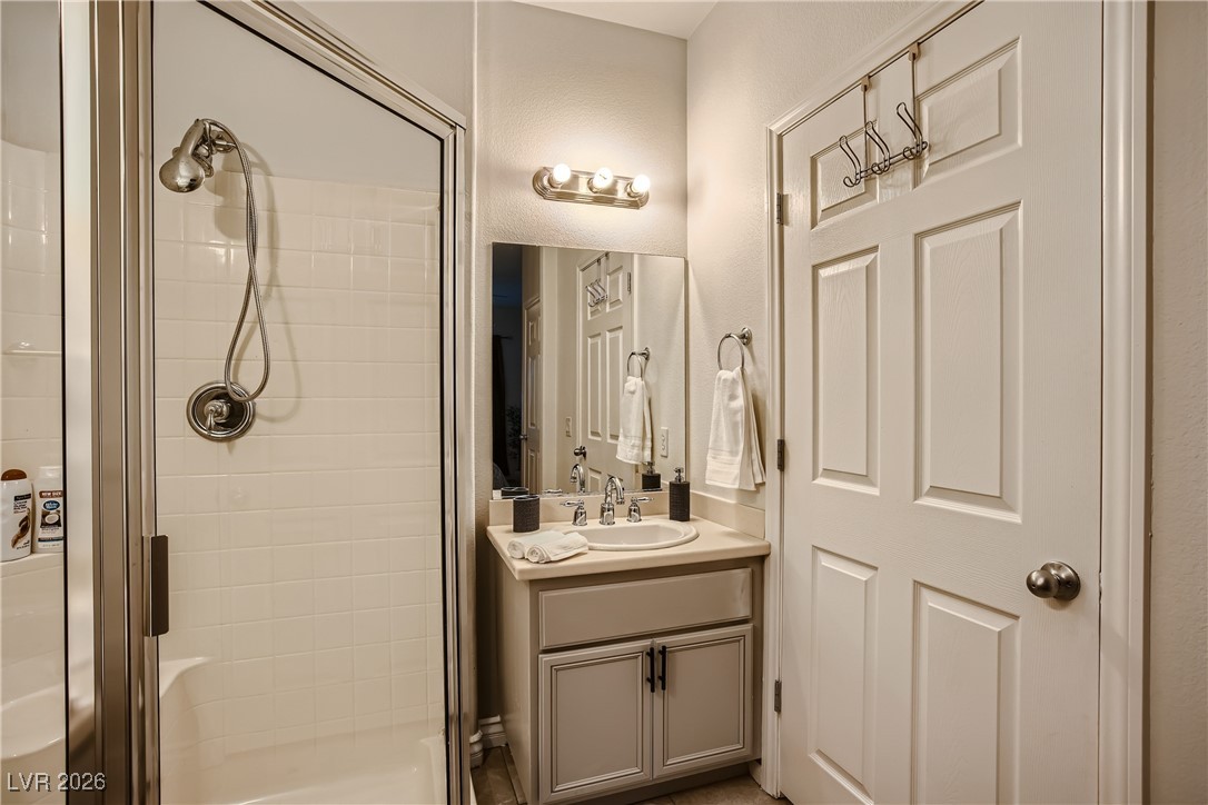 7701 West Robindale Road, Unit 149 Las Vegas, NV 89113 - Photo 14 of 22 Full bath with vanity and a stall shower