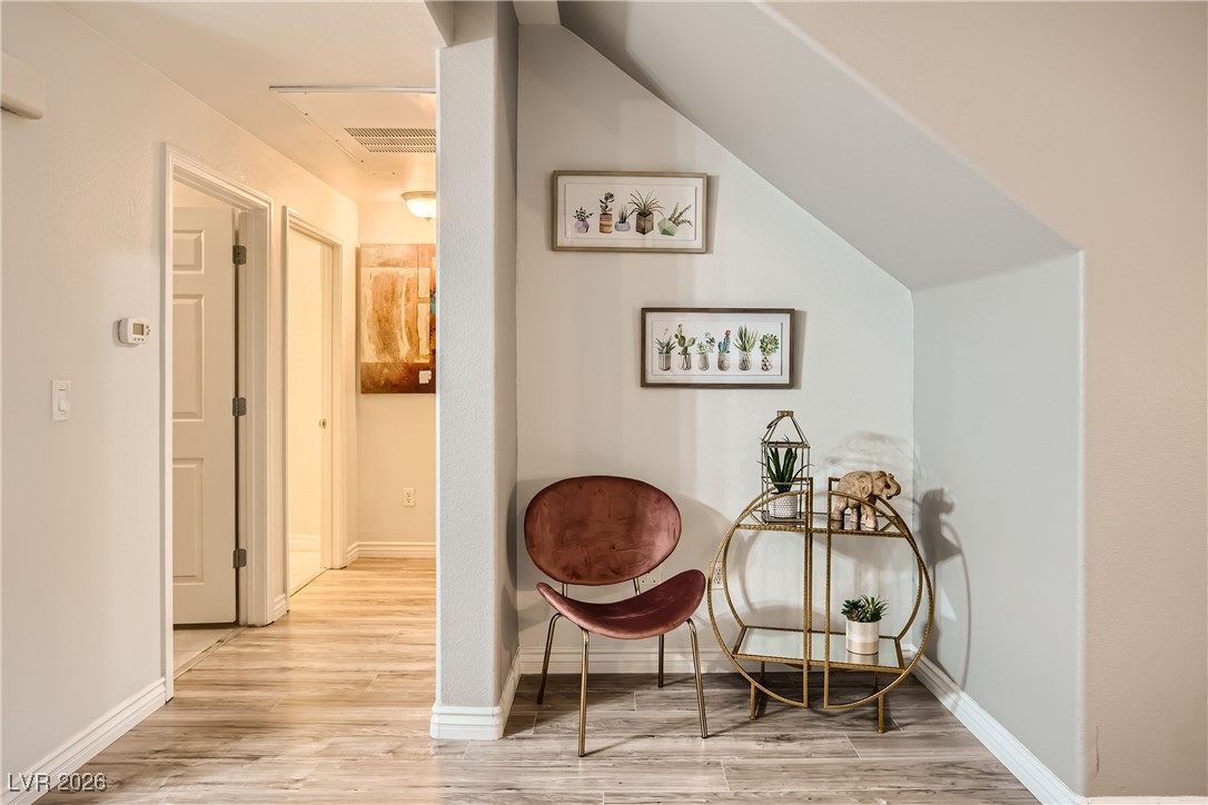 7701 West Robindale Road, Unit 149 Las Vegas, NV 89113 - Photo 20 of 22 Sitting room featuring light wood finished floors and cooling unit