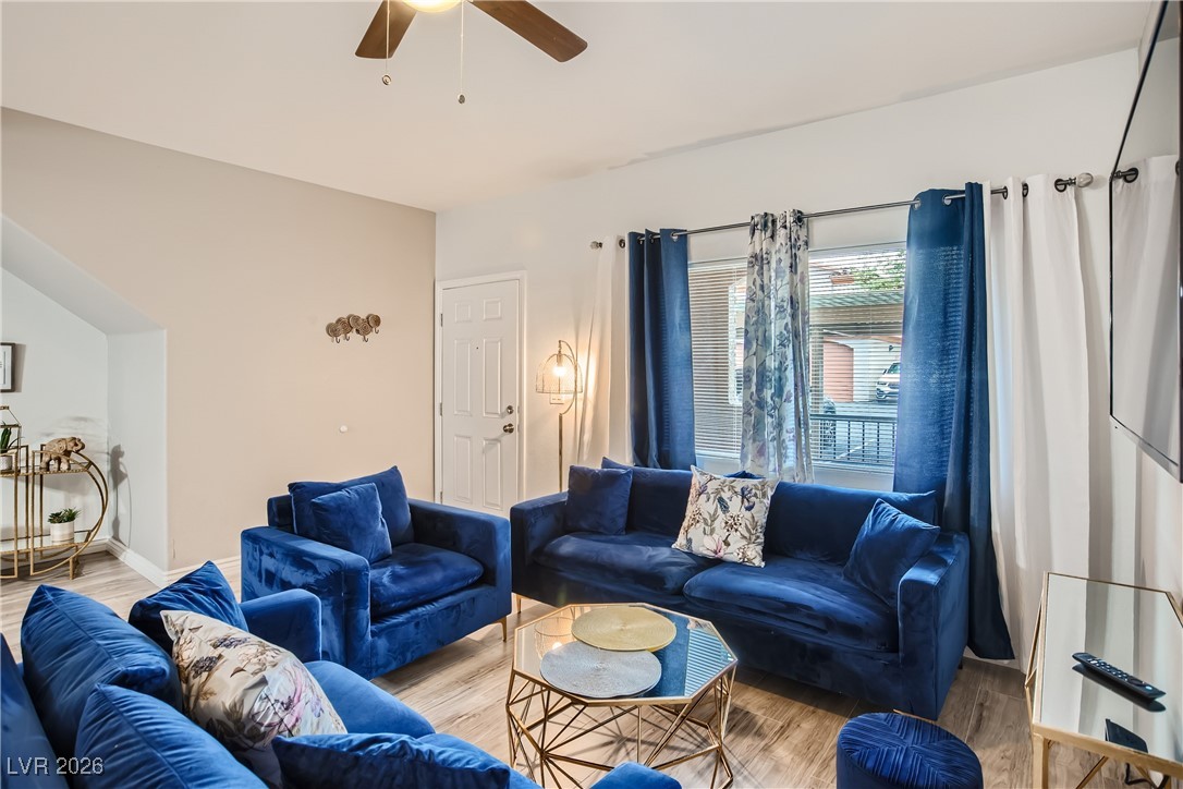 7701 West Robindale Road, Unit 149 Las Vegas, NV 89113 - Photo 5 of 22 Living room featuring wood finished floors and ceiling fan