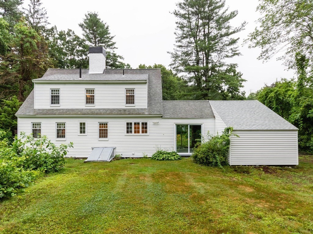 106 Boston Post Road Wayland, MA 01778 - Photo 36 of 42 a white house that has a tree in front of it