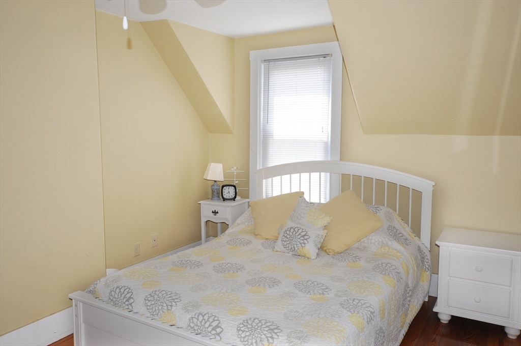 9 15th Street Wareham, MA 02558 - Photo 17 of 27 a large bed sitting in a bedroom next to a window