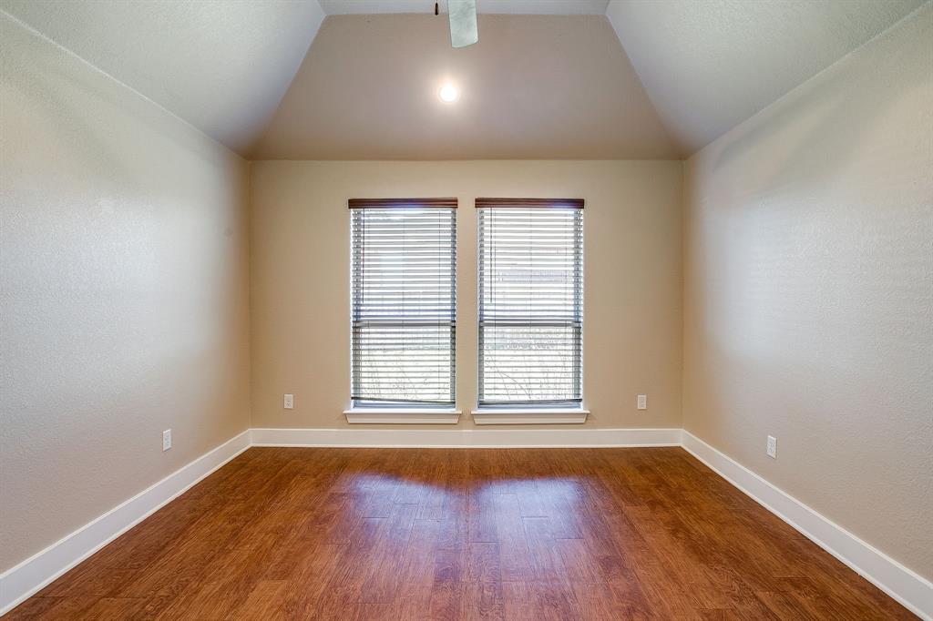 110 Hummingbird Drive Weatherford, TX 76085 - Photo 19 of 38 an empty room with wooden floor and windows