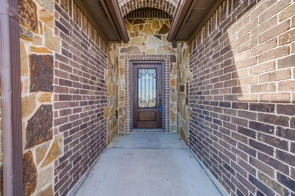110 Hummingbird Drive Weatherford, TX 76085 - Photo 2 of 38 a view of a brick house with a brick wall