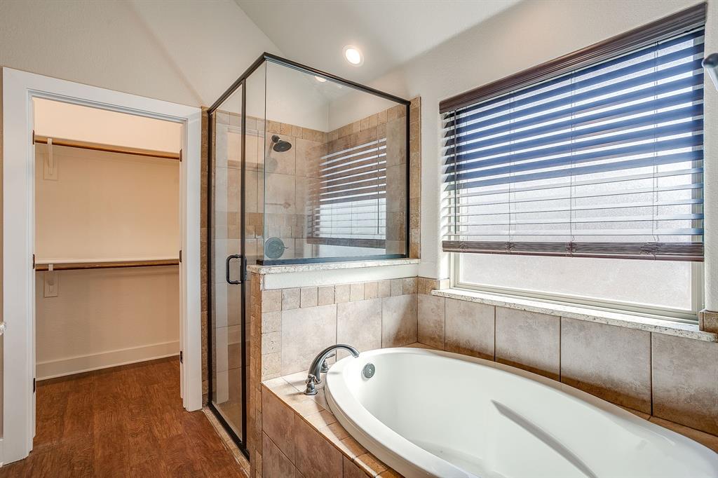 110 Hummingbird Drive Weatherford, TX 76085 - Photo 25 of 38 a bathroom with a bathtub and a shower