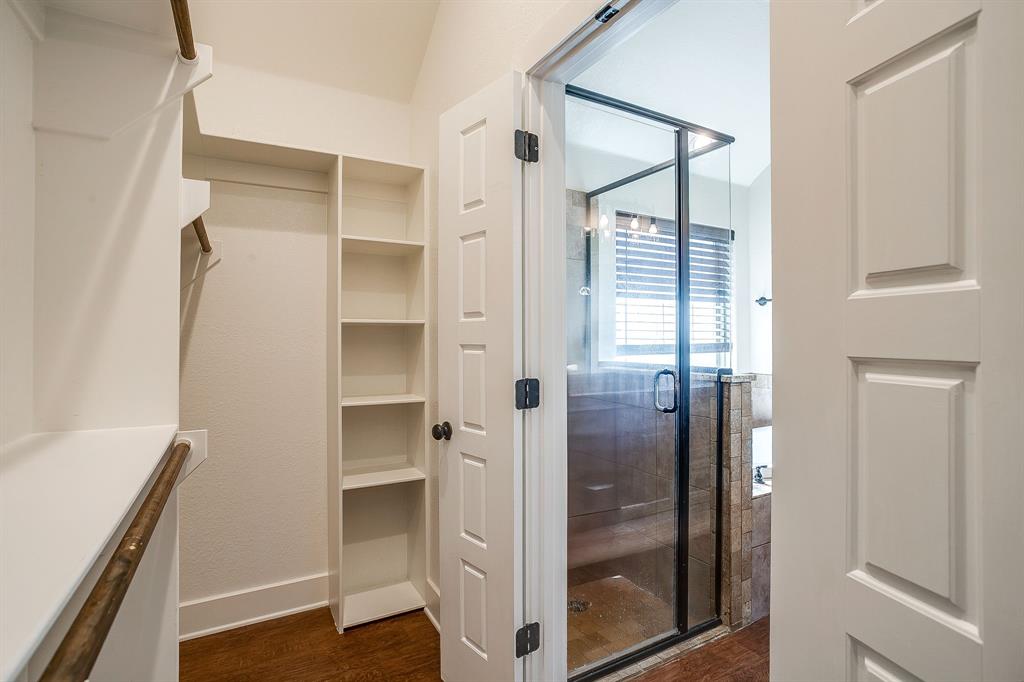 110 Hummingbird Drive Weatherford, TX 76085 - Photo 28 of 38 a bathroom with a glass shower door and a bathtub