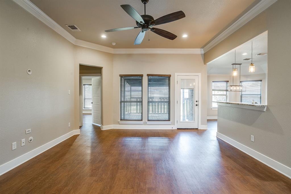 110 Hummingbird Drive Weatherford, TX 76085 - Photo 6 of 38 a view of an empty room with window and wooden floor